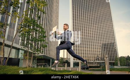 business success. manager man hold pc. hurring running entrepreneur. agile business. Stock Photo