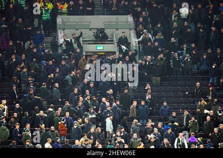 Tottenham Hotspurs fans react as incident in the stands results in a break in play during the Carabao Cup Semi Final, second leg match at the Tottenham Hotspur Stadium, London. Picture date: Wednesday January 12, 2022. Stock Photo
