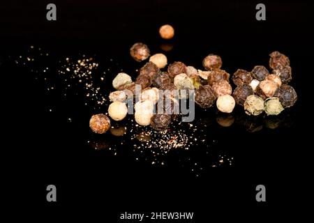 powdered pepper punches on black background Stock Photo