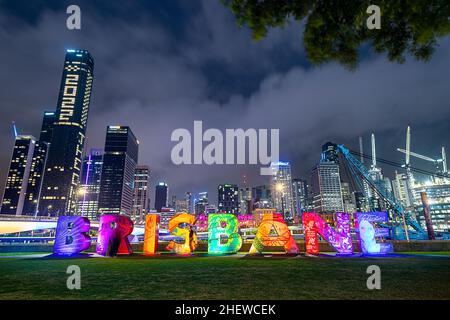 Brisbane artwork sign at Southbank Parklands with Brisbane CBD skyline in background, Brisbane, Australia Stock Photo