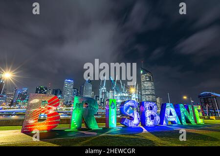 Brisbane artwork sign at Southbank Parklands with Brisbane CBD skyline in background, Brisbane, Australia Stock Photo