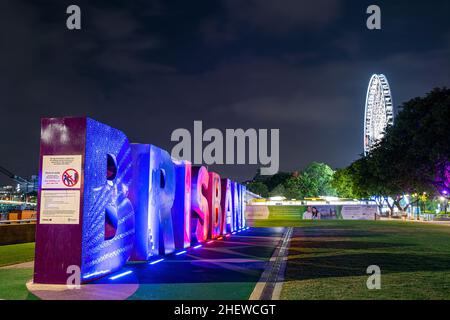 Brisbane artwork sign at Southbank Parklands with Brisbane CBD skyline in background, Brisbane, Australia Stock Photo