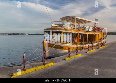 SIBENIK, CROATIA - MAY 25, 2019: Wooden tour boat in Sibenik port, Croatia Stock Photo