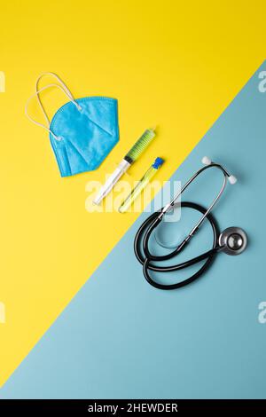 four elements of medical material placed aligned on a two-color background, vertical image Stock Photo
