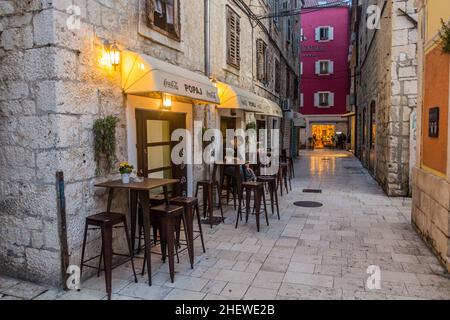 SPLIT, CROATIA - MAY 27, 2019: Alley and Fast Food Popaj in Split, Croatia Stock Photo