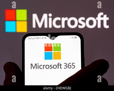 Ukraine. 12th Jan, 2022. In this photo illustration, the Microsoft 365 logo is seen displayed on a smartphone and Microsoft logo in the background. (Photo by Igor Golovniov/SOPA Images/Sipa USA) Credit: Sipa USA/17�Թ����� Live News Stock Photo