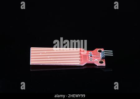 Water level depth detection sensor for Arduino projects isolated on black background Stock Photo