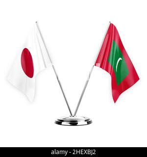 Two table flags isolated on white background 3d illustration, japan and maldives Stock Photo