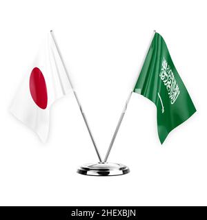 Two table flags isolated on white background 3d illustration, japan and saudi arabia Stock Photo
