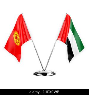 Two table flags isolated on white background 3d illustration, kyrgyzstan and united arab emirates Stock Photo