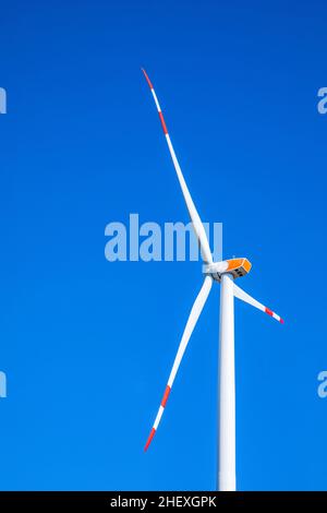 wind turbine under clear blue sky Stock Photo - Alamy