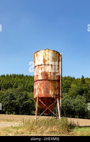 landscape with old rusty silo at the field Stock Photo