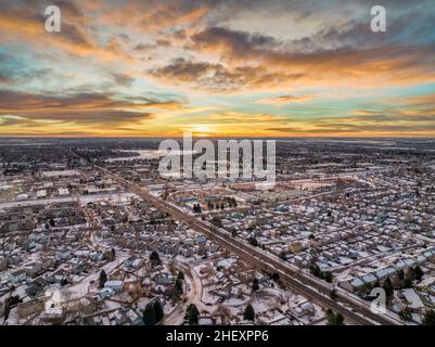 winter sunrise over Fort Collins and plains in northern Colorado, aerial view of residential streets and shopping centers Stock Photo