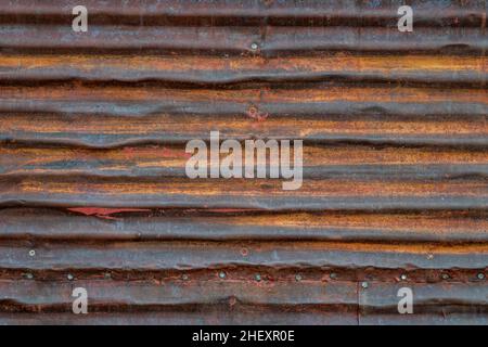 old, grunge, rusty, corrugated metal texture background - wall of weathered shack Stock Photo