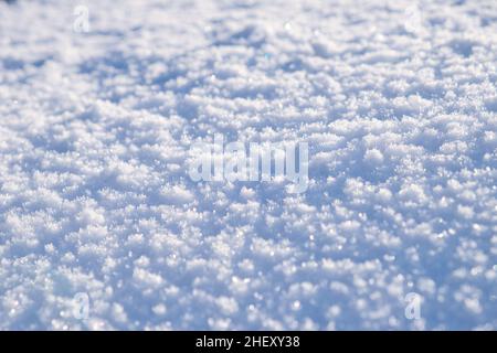 Snow surface texture in light blue tone. Winter season background. Stock Photo
