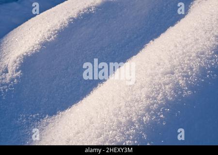Snow surface texture in light blue tone. Winter season background. Stock Photo