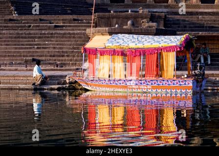 Boat for tourist on the bank of Narmada river on Maheshwar Ghat state Madhya Pradesh India Stock Photo