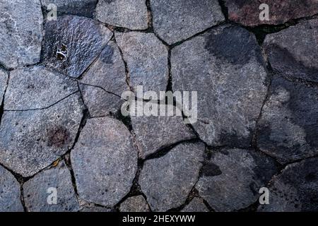 texture of half wet gray rocks create a beautiful natural pattern for exotic nature background and wallpaper Stock Photo