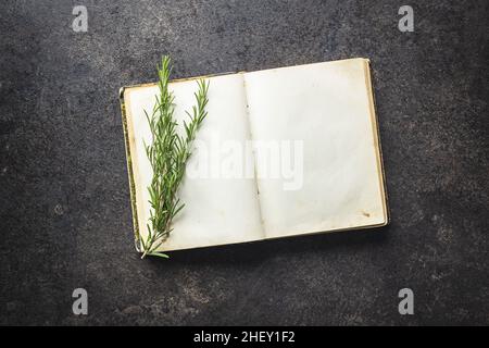 Blank cookbook and spice. Recipe book with rosemary branch. Stock Photo