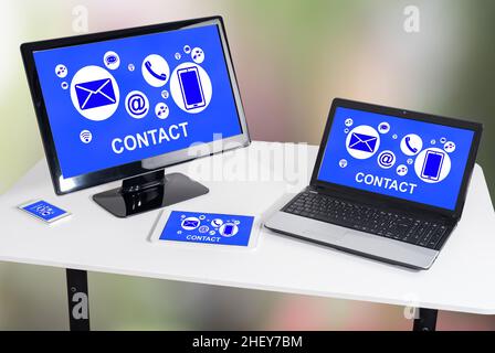 Contact concept shown on different information technology devices Stock Photo