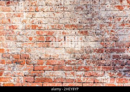 old red grungy brick wall gives a harmonic structure Stock Photo