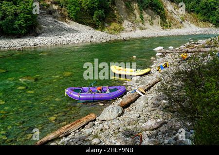 White water rafting trip on the Upper Grey river, south island, New Zealand. Rafts tied up at the end of the day. Stock Photo