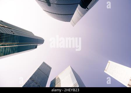Skyscraper tops against lilac sky. Low angle view Stock Photo