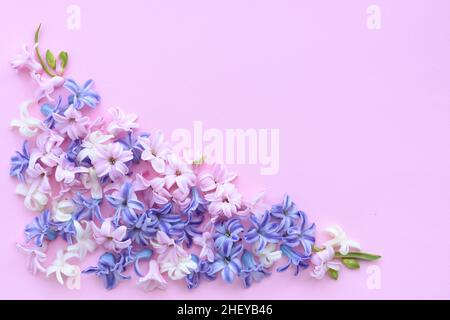Flowers composition. Frame made of hyacinth flowers on pink background. Flat lay, top view, copy space Stock Photo
