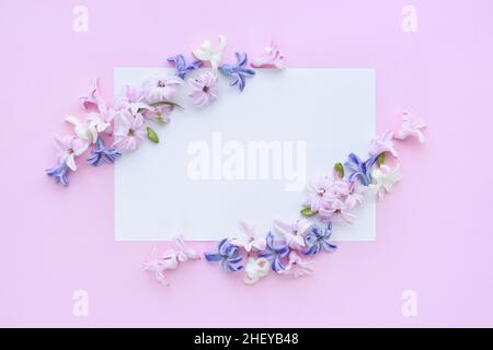 Flowers composition. Frame made of hyacinth flowers on pink background. Flat lay, top view, copy space Stock Photo