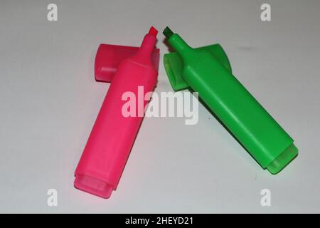 Close up of two highlighters each in pink and green Stock Photo