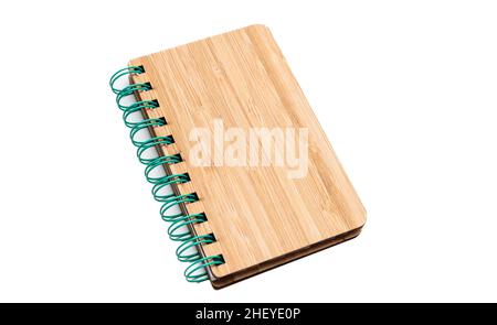 Spiral notepad isolated on white background. Blank wooden cover green binder pad, hardcover closed notebook Stock Photo