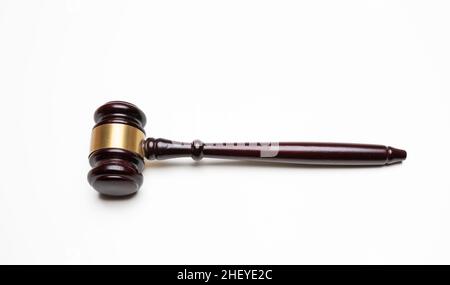 Judge gavel isolated cutout on white. Auction or law symbol, wooden hammer with bronze detail overhead shot, design element Stock Photo