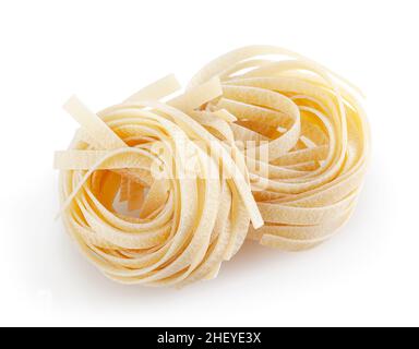 Uncooked tagliatelle pasta isolated on white background with clipping path Stock Photo