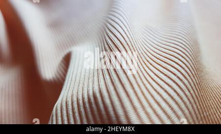 Beige cotton fabric with stripes, wavy background close up. Stock Photo