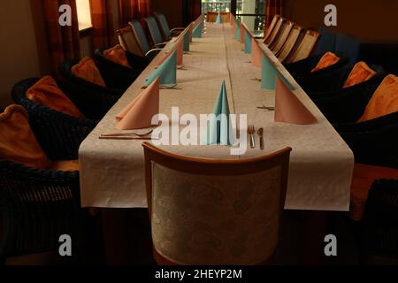 Simple table setting in a restaurant for the holiday. Stock Photo