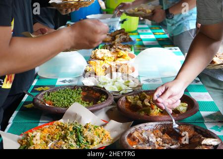 Various kinds of menus are served in a buffet manner which is usually at a meeting, party, wedding or family gathering. Stock Photo