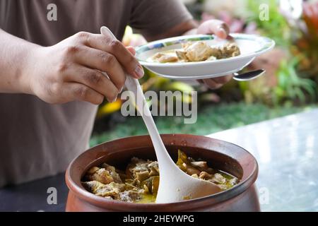 Vegetable curry chicken curry on a basin or stove made of clay. Stock Photo