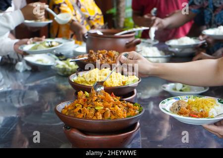 Various kinds of menus are served in a buffet manner which is usually at a meeting, party, wedding or family gathering. Stock Photo