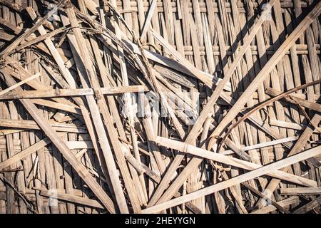 Real nature abstract background. Bamboo straws weaving texture mat, light gray yellow brown beige colour vintage effect. Calm warm simple life style Stock Photo