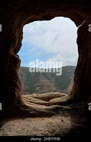 View from the dwelling in the cave. A passage carved in stone. Stock Photo