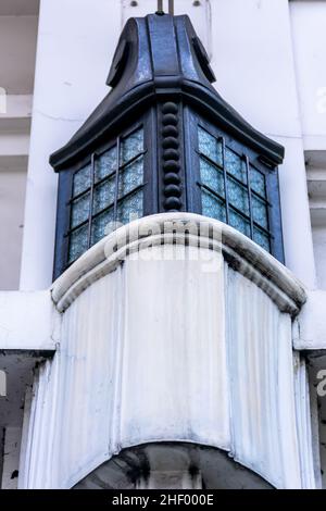 black metal vintage ornament city lamp above the pillar on the white heritage building architecture Stock Photo