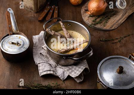 Stewed rabbit legs with sour cream Stock Photo