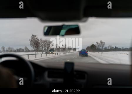 Car went off the slippery road. Difficult weather conditions on the road. Stock Photo