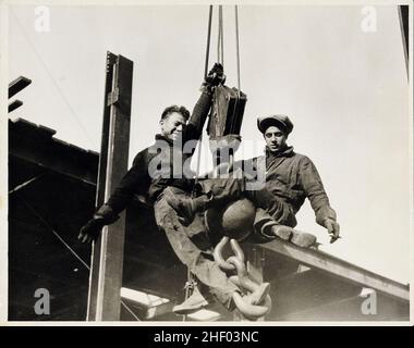 Young structural workers high up on Empire State Building, c 1930. Vintage New York photo. Stock Photo