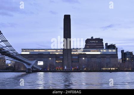 Tate Modern Art Galley building on the south bank of river Thames, dusk view from the north bank, London UK.