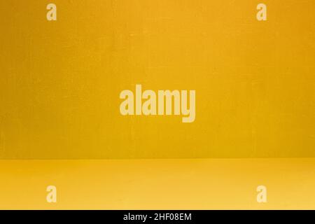 Yellow textured wall and floor with some small white spots and dirt. Artistic painted background. Abstract art with copy space. Stock Photo