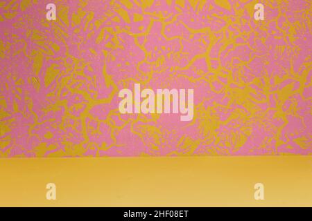 Art wall decorated with paintings forming dynamic abstract shapes on the pastel-colored background and yellow floor. Original designs with texture bac Stock Photo