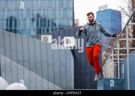 Man practicing parkour in the city Stock Photo