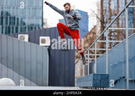 Man practicing parkour in the city Stock Photo