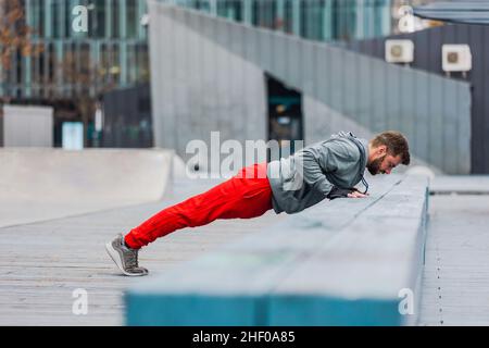 Young man exercising in urban setting Stock Photo